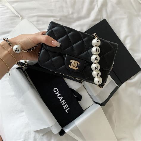 chanel large pearl handle bag|Chanel bag with pearl chain.